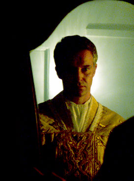 Cameron Daddo as Fr. Michael Kelley